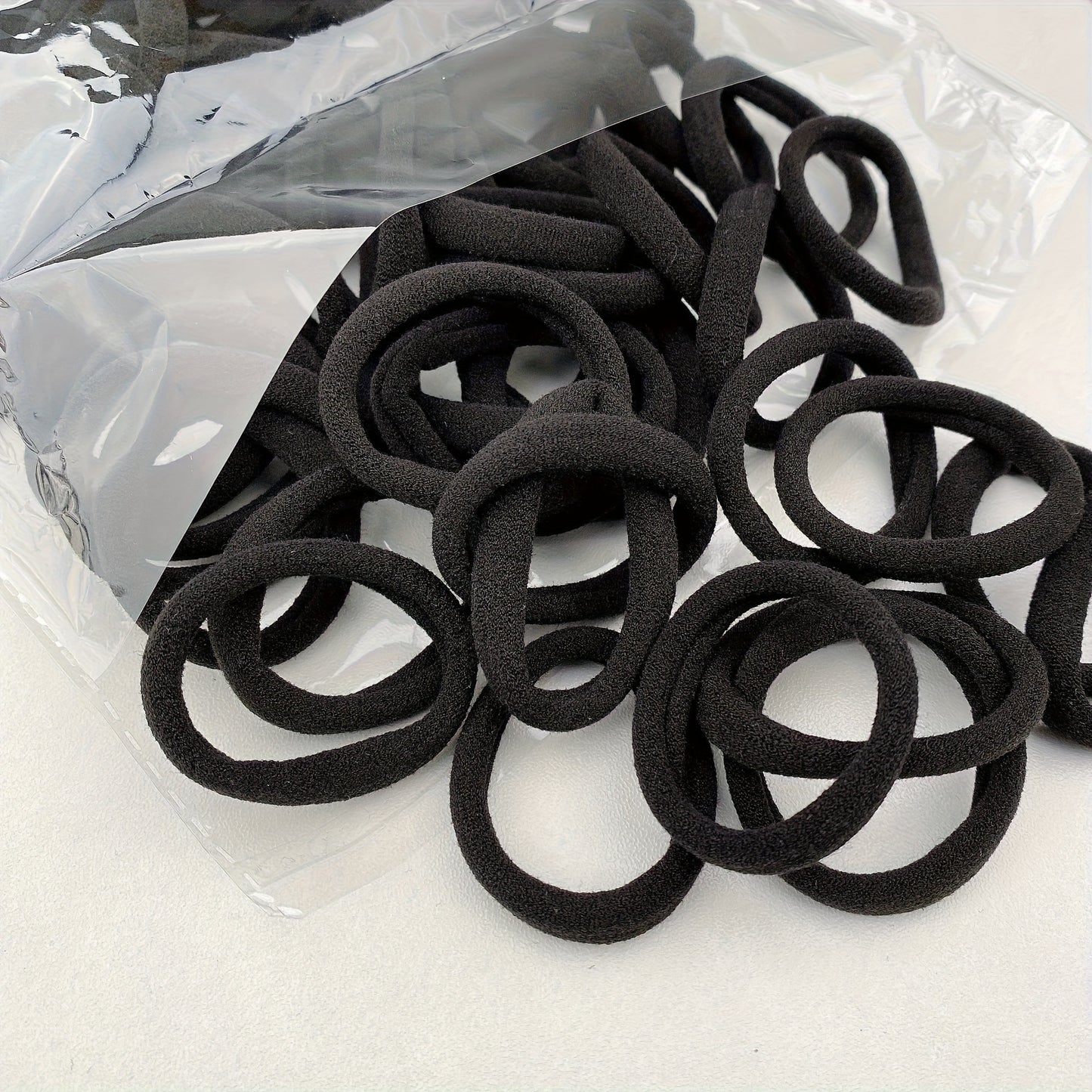 50-Pack High Elasticity Black Hair Ties - Simple Design for Everyday Styling and Versatile Use